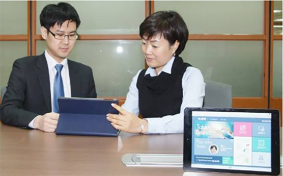 KEB Hana Bank banker and customer using the new banking system