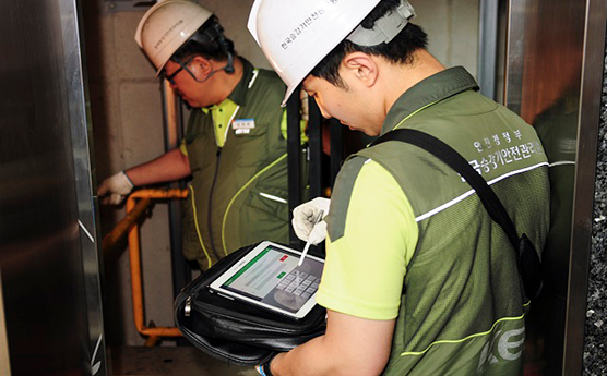 Staff from Korea Elevator Safety Agency checking elevators