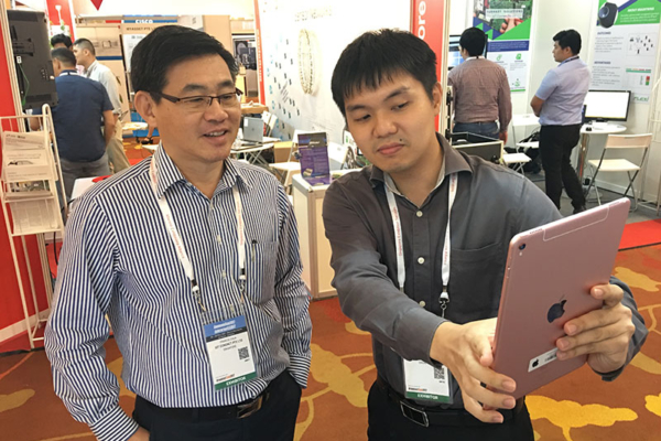 Collin showcasing Smart e-Form to visitor