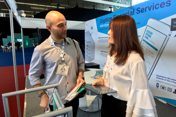 Juan, Marketing Manager, speaking to guest at Money 20/20 Europe 