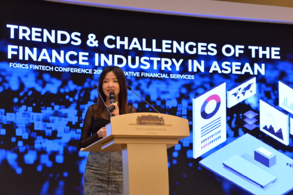 Daphne Ng, CEO of JEDTrade, presenting on stage